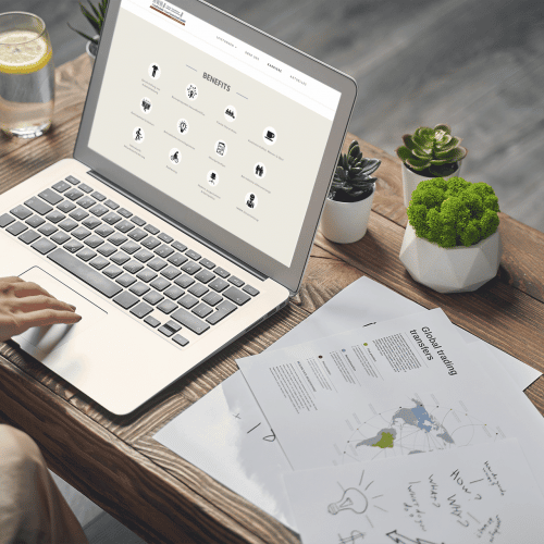 mockup-of-a-macbook-on-a-wooden-desk-with-small-plants-m15631-r-el2
