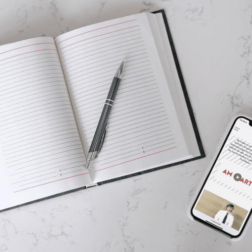 mockup-of-an-iphone-13-lying-next-to-an-open-journal-m24612-r-el2