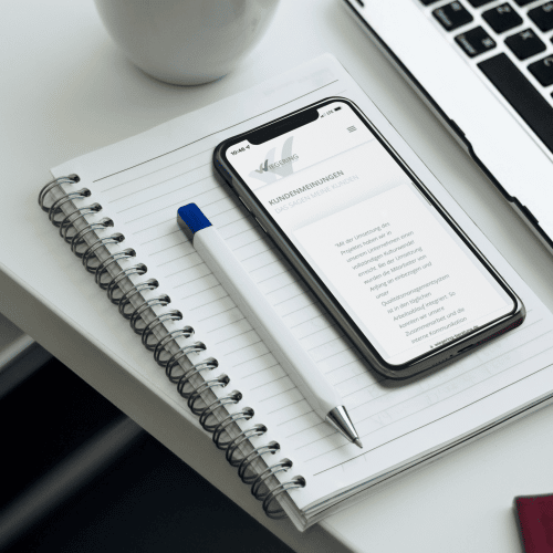 mockup-of-an-iphone-x-lying-on-an-office-desk-a17390